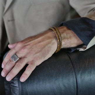 Round dark brown wrap genuine leather design, with a black steel clasp