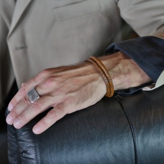 Round light brown wrap genuine leather design, with a black steel clasp